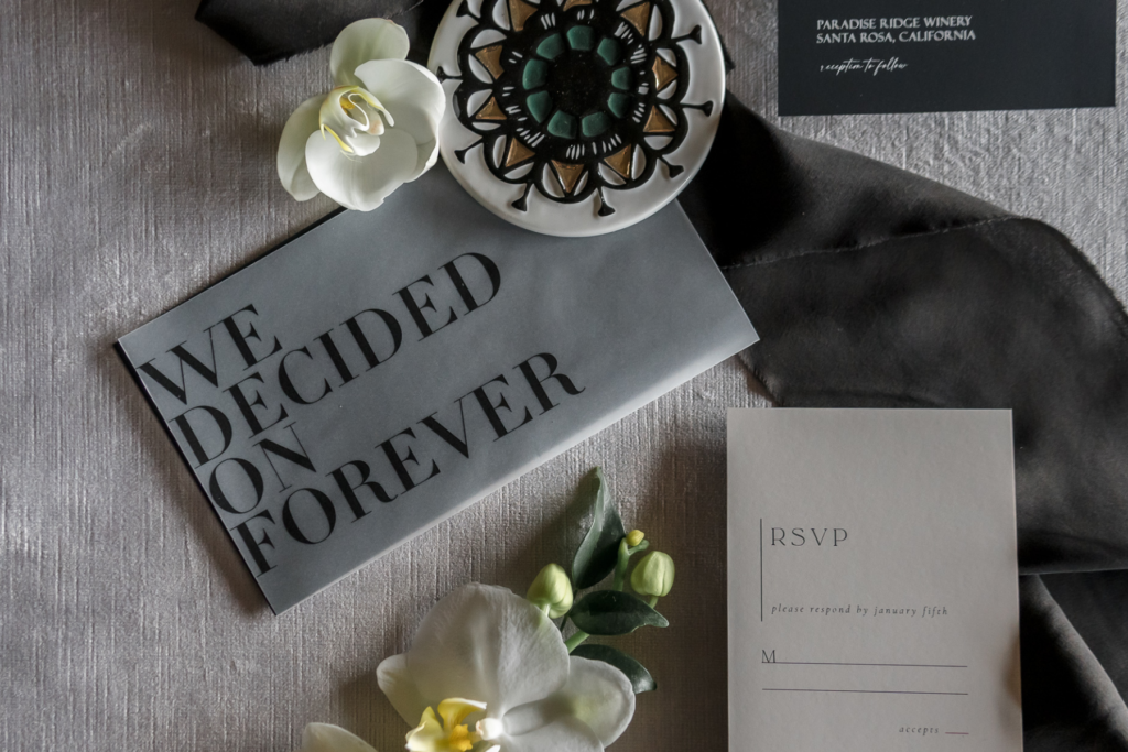 Black and White Flat Lay of Wedding Invitation Suite